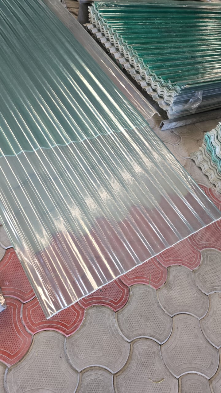 Clear/translucent FRP corrugated sheet panel with glossy finish, ready for roofing/skylight use.