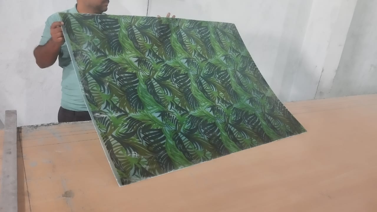 FRP printed sheet sample showing glossy surface and print detail.