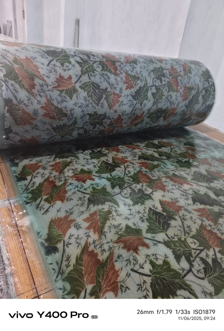 FRP printed sheet panel in workshop, ready for cutting and installation.