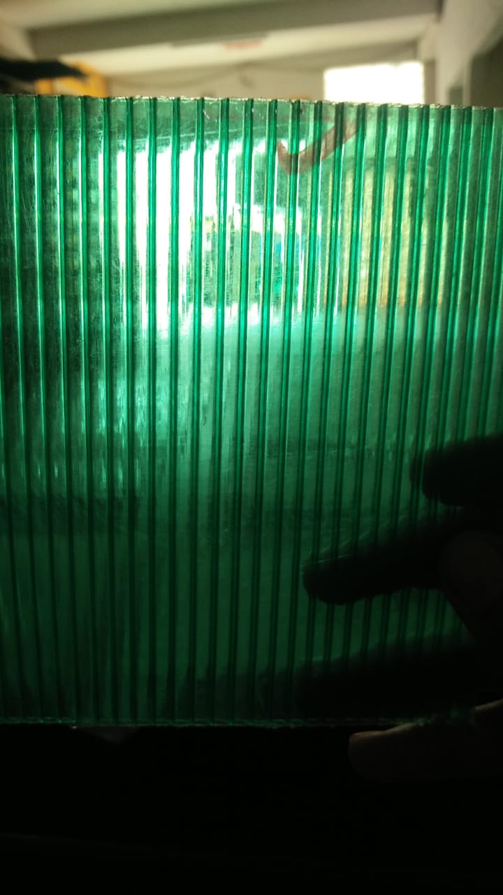 Blue translucent multiwall sheet sample showing internal flutes and edge detail.