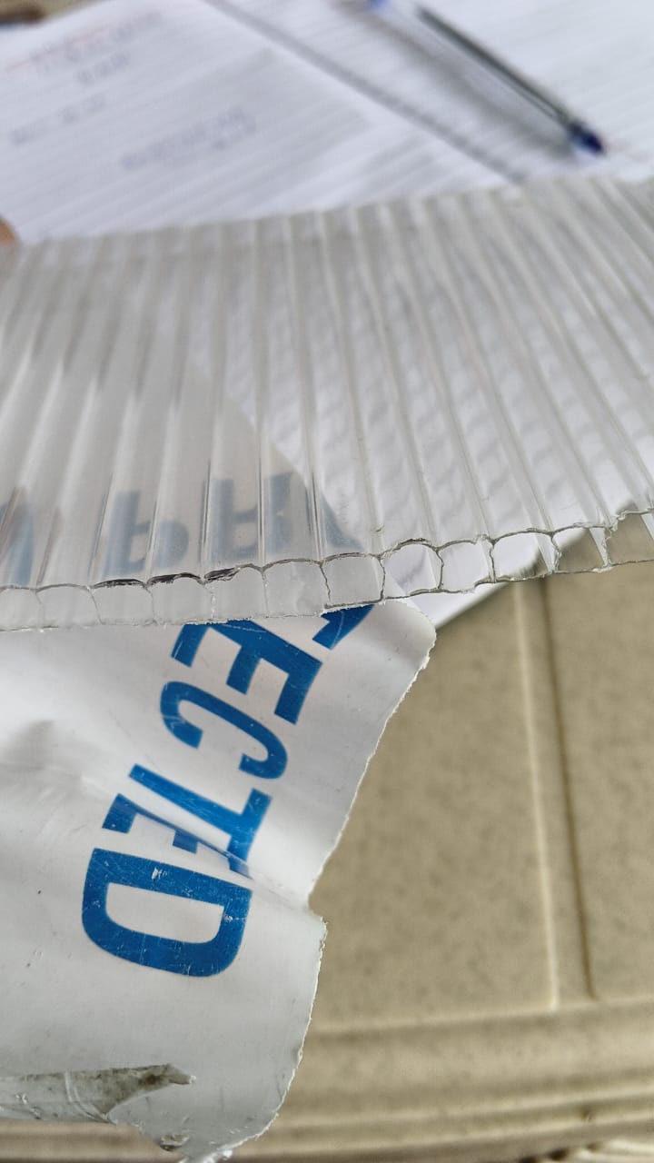 Clear multiwall polycarbonate sheet with protective film partially peeled.
