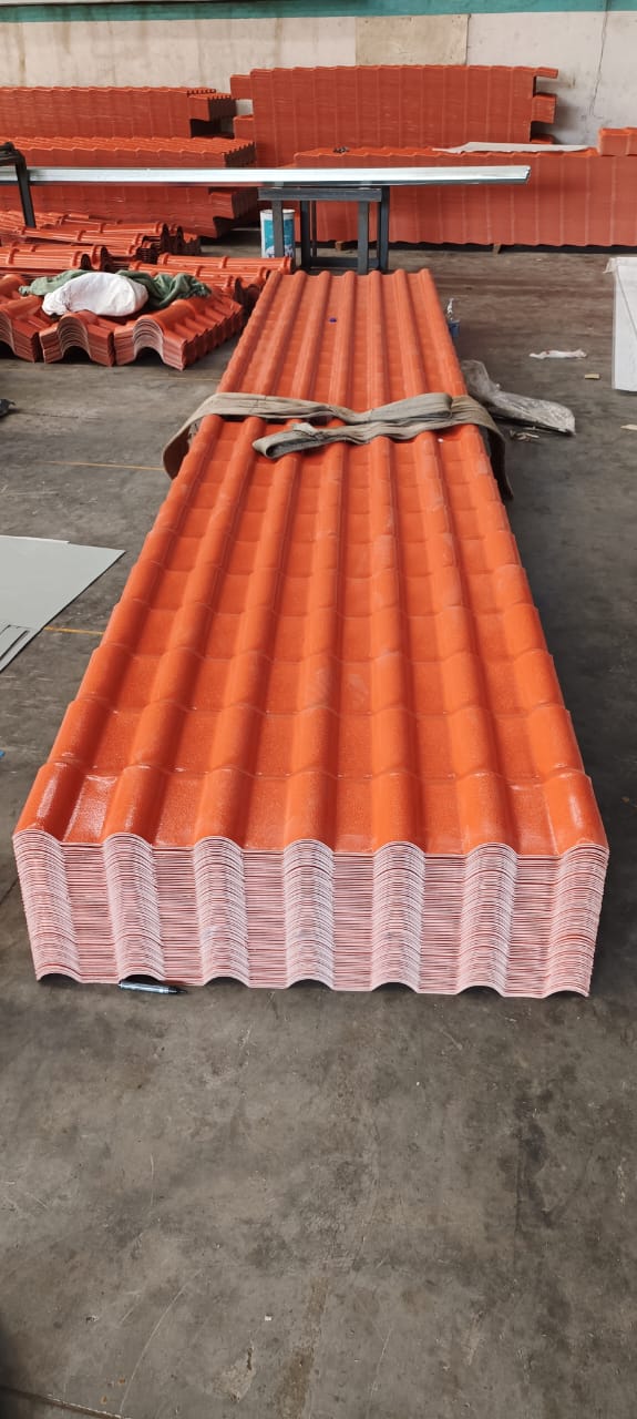 Stack of terracotta UPVC tiled roof sheets ready for dispatch.